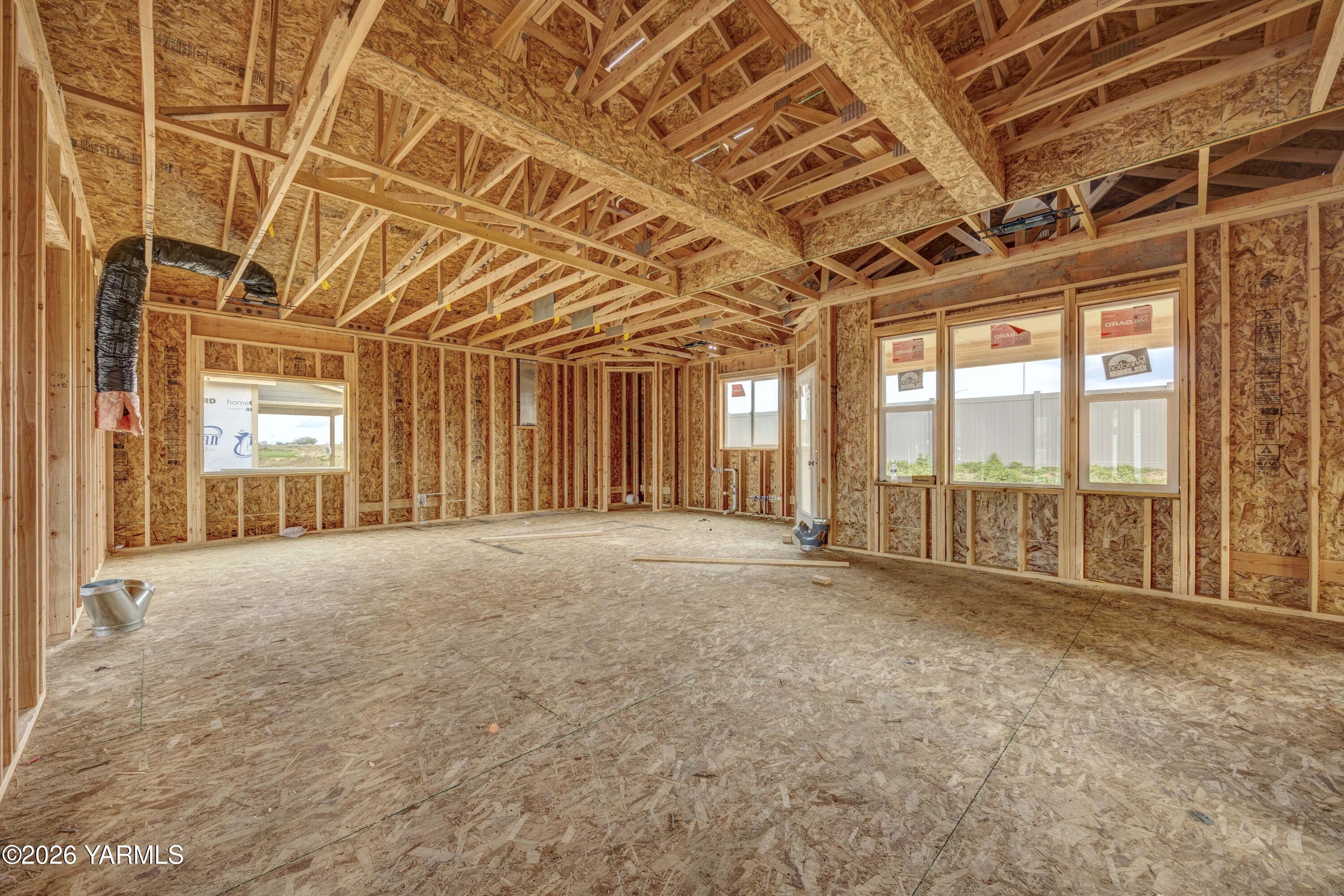 211 Packer Street Prosser, WA 99350 - Photo 4 of 31 a view of an empty room with a sliding door
