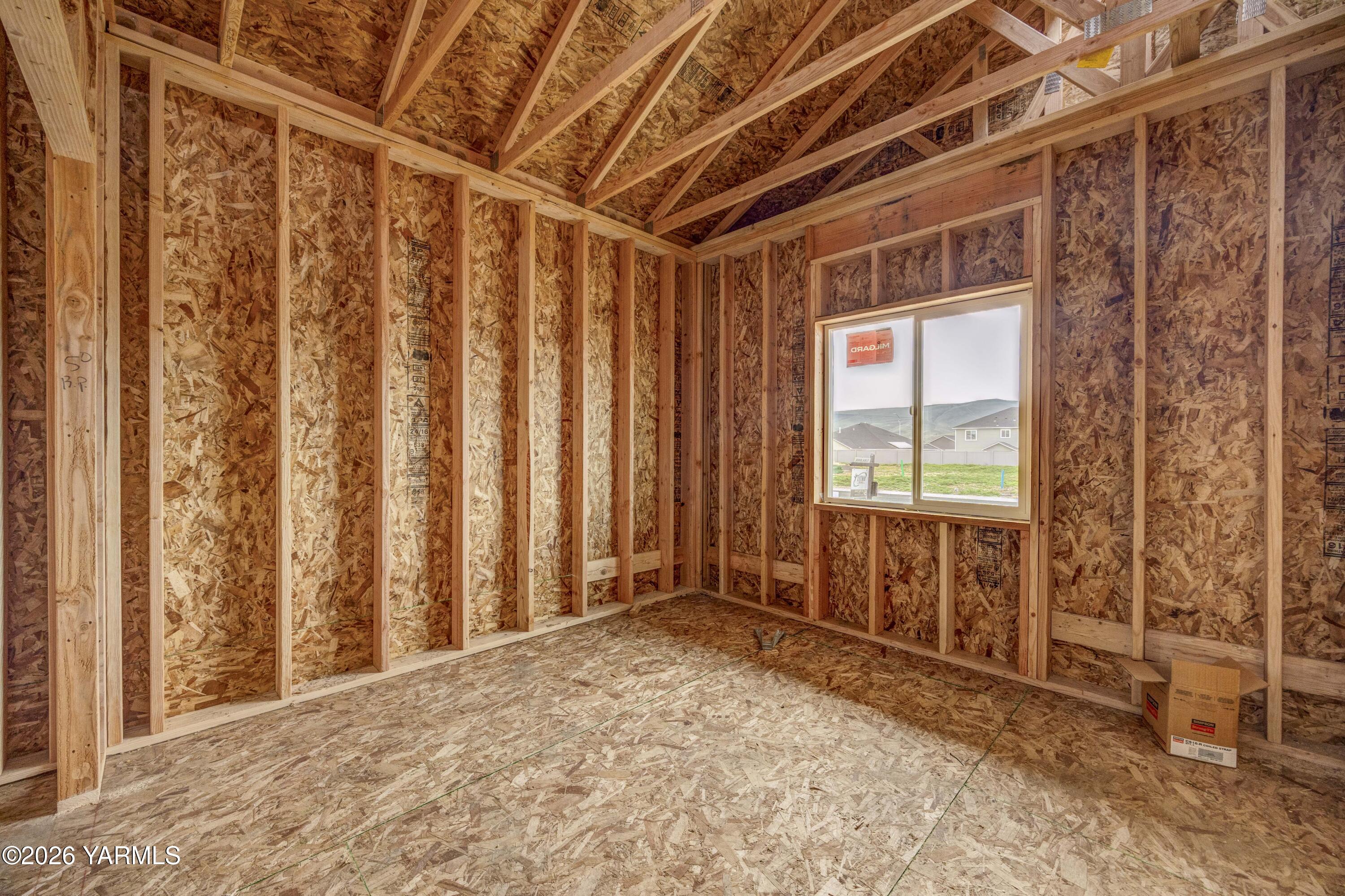 211 Packer Street Prosser, WA 99350 - Photo 9 of 31 a view of an empty room with a window
