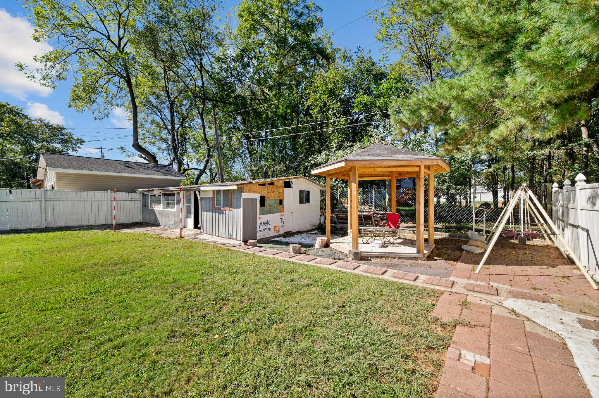 3414 Milford Mill Road Baltimore, MD 21244 - Photo 42 of 44 a view of a house with backyard porch and sitting area