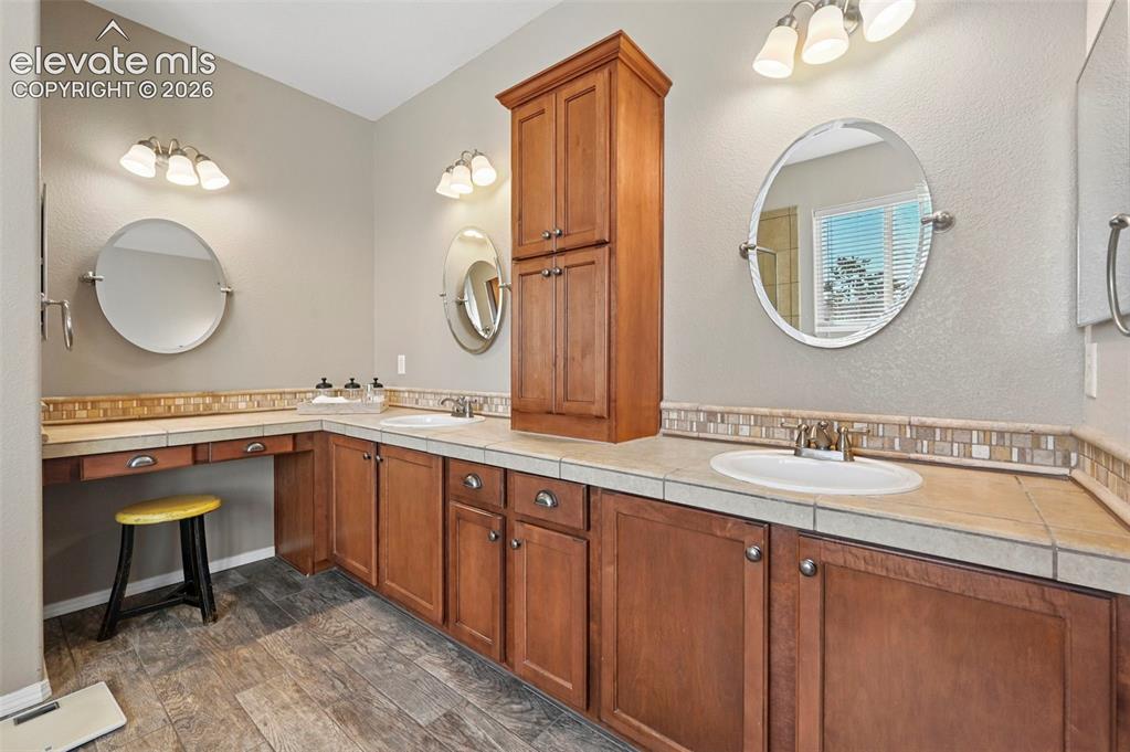 7216 Sylamore Way Peyton, CO 80831 - Photo 13 of 30 Double sinks, tons of storage and makeup counter.