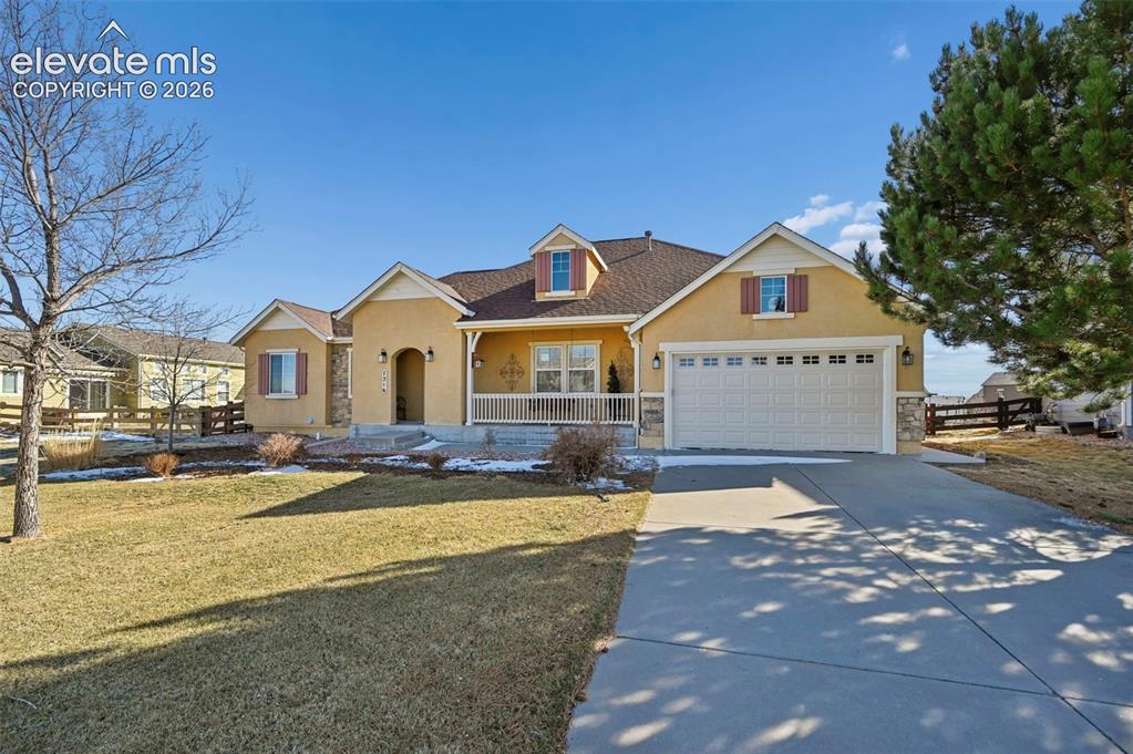 7216 Sylamore Way Peyton, CO 80831 - Photo 28 of 30 Ranch-style exterior with stucco finish and stone accents