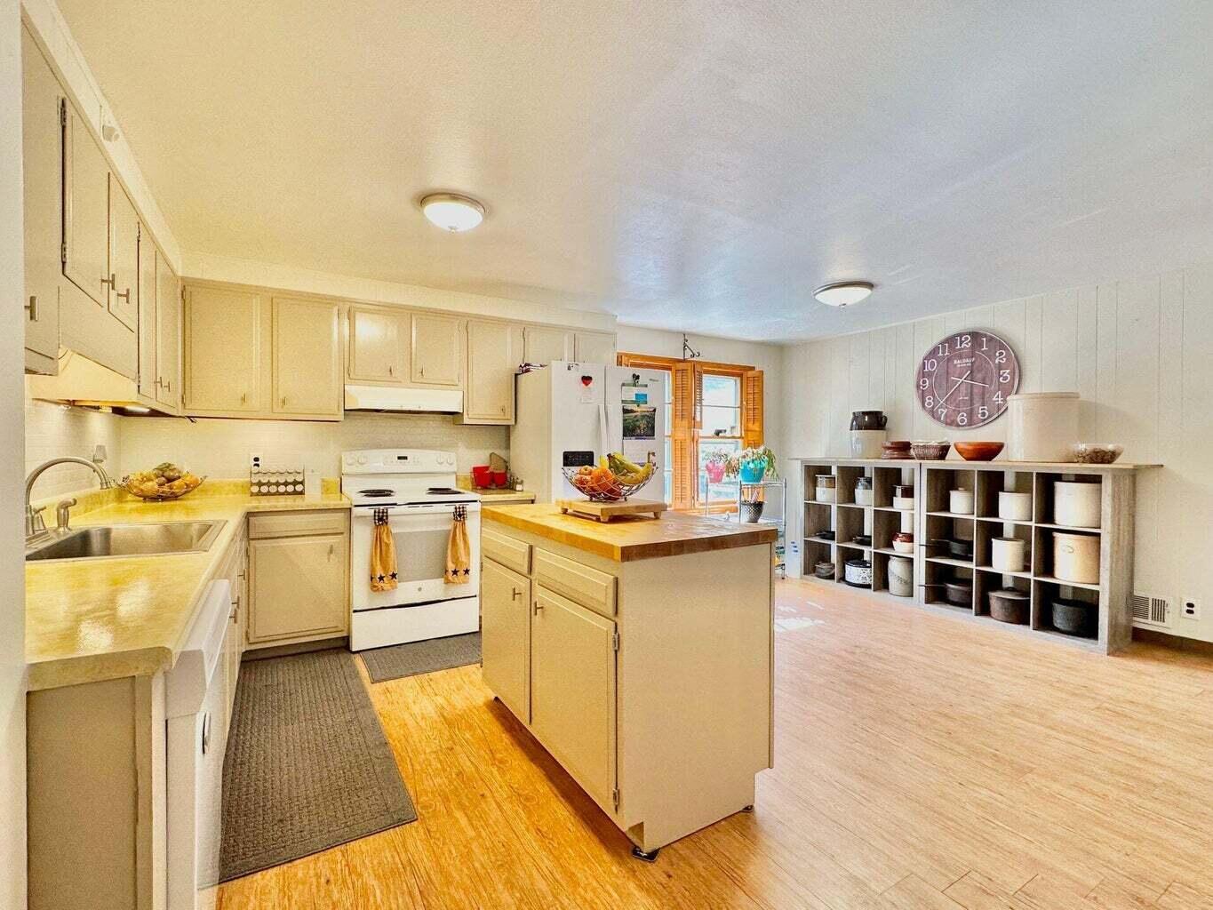 6989 Poage Valley Rd Extension Roanoke, VA 24018 - Photo 12 of 33 a open kitchen with cabinets a stove and wooden floor