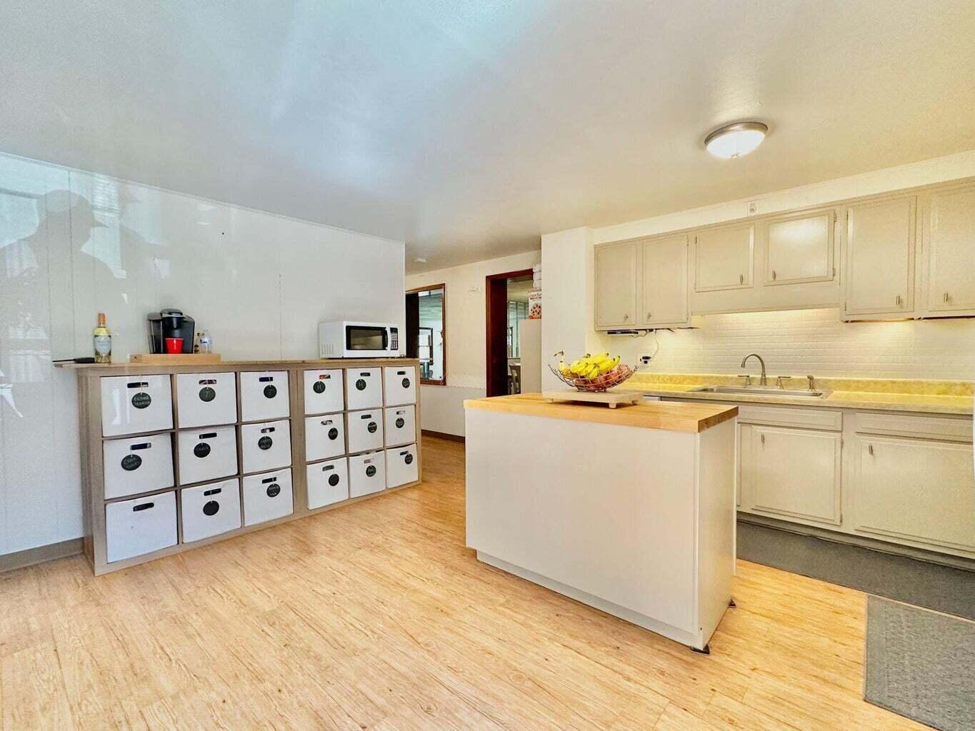 6989 Poage Valley Rd Extension Roanoke, VA 24018 - Photo 13 of 33 a large white kitchen with cabinets