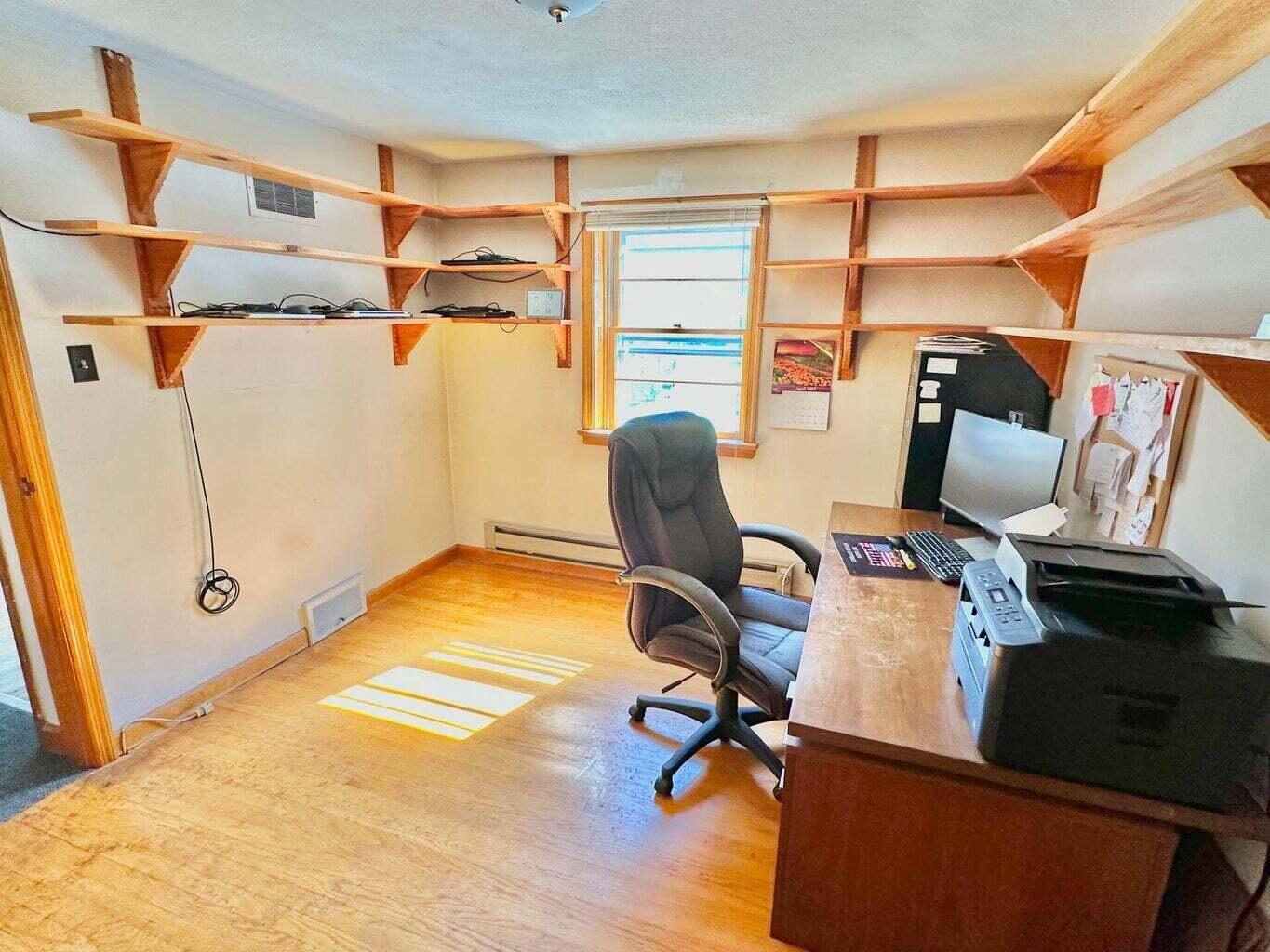 6989 Poage Valley Rd Extension Roanoke, VA 24018 - Photo 14 of 33 a view of a workspace with furniture and a window