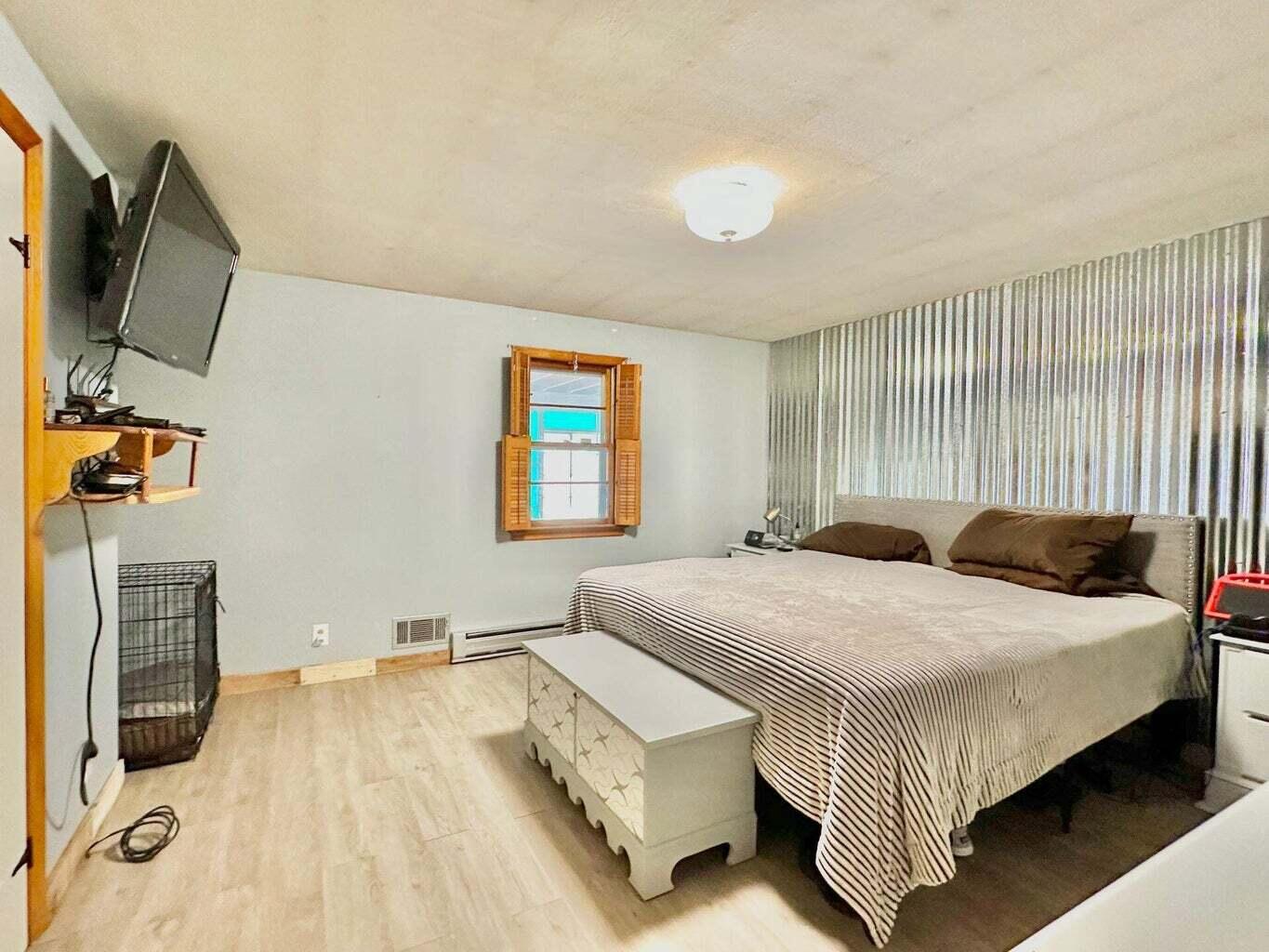 6989 Poage Valley Rd Extension Roanoke, VA 24018 - Photo 17 of 33 a bedroom with a bed and a flat screen tv