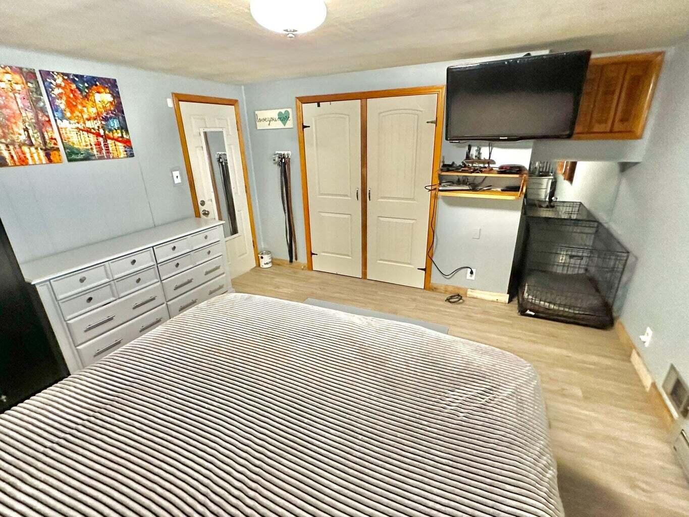 6989 Poage Valley Rd Extension Roanoke, VA 24018 - Photo 18 of 33 a bedroom with a bed and a flat tv screen on dresser