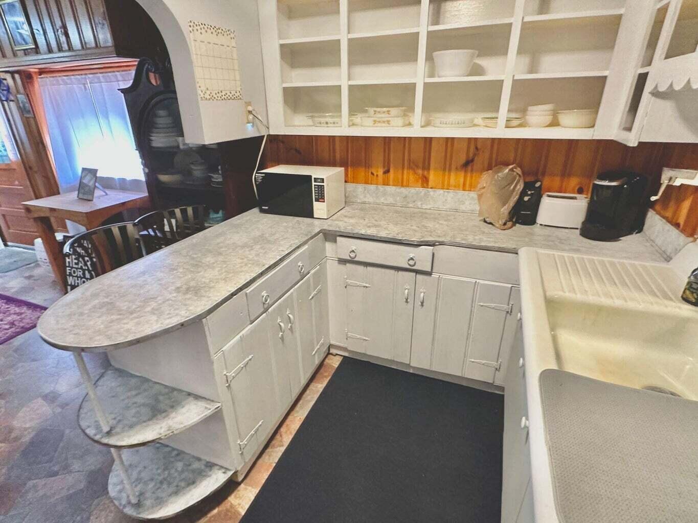 6989 Poage Valley Rd Extension Roanoke, VA 24018 - Photo 20 of 33 a kitchen with a sink and a stove