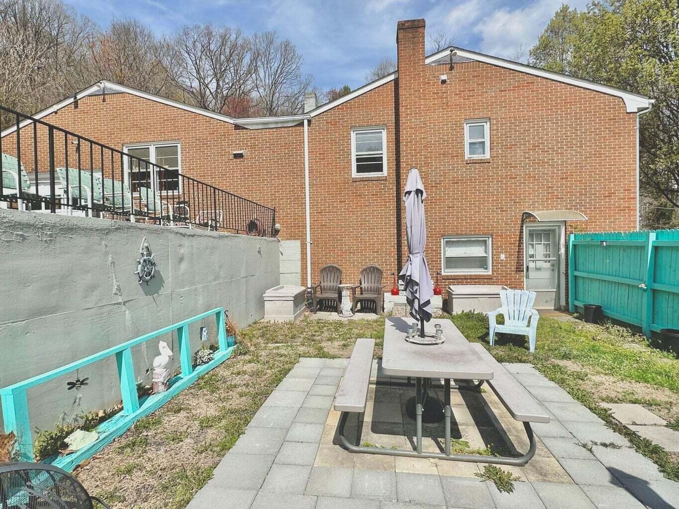 6989 Poage Valley Rd Extension Roanoke, VA 24018 - Photo 23 of 33 a view of a patio with couches table and chairs with wooden floor