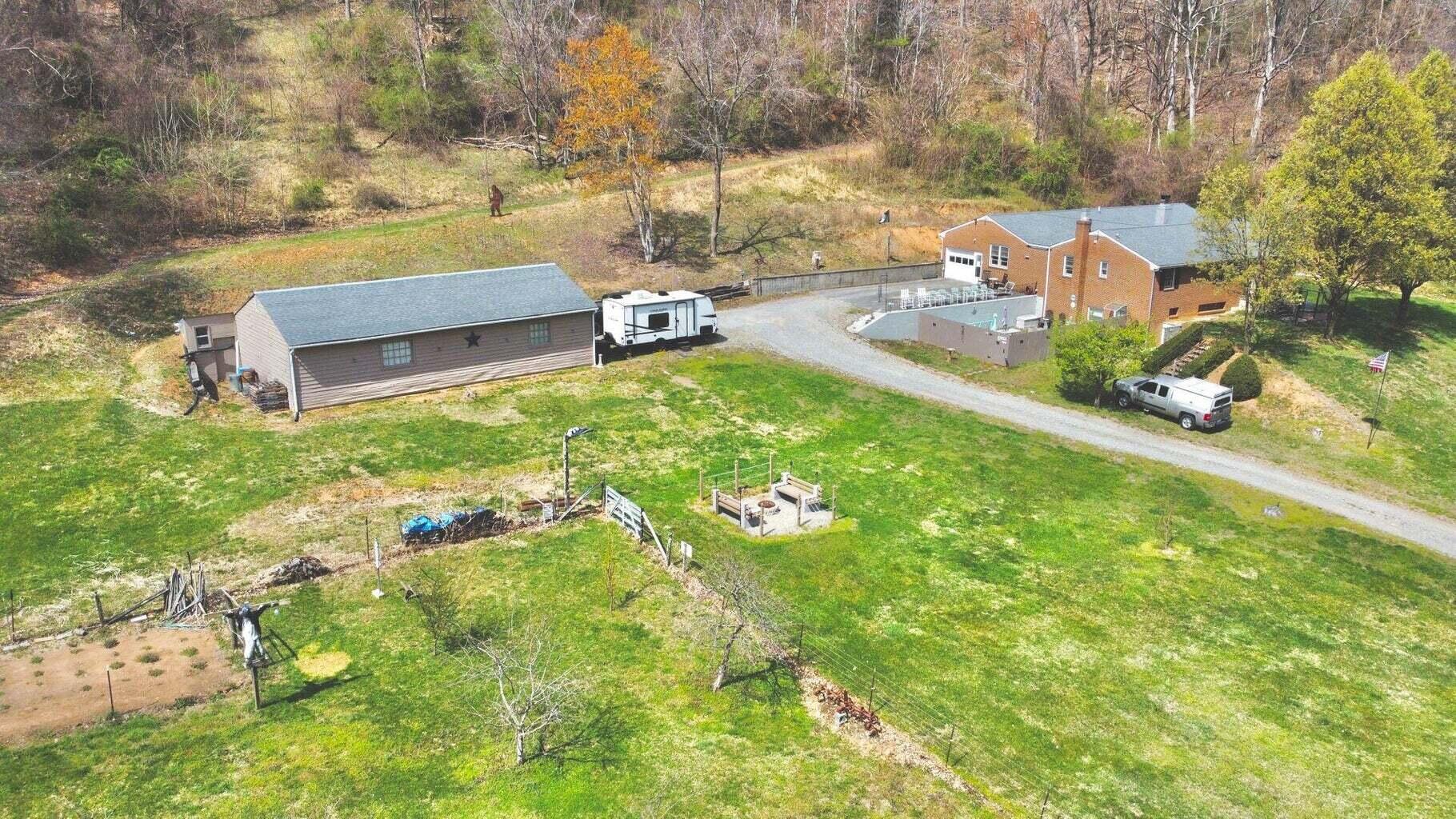 6989 Poage Valley Rd Extension Roanoke, VA 24018 - Photo 31 of 33 a view of a garden with lawn chairs
