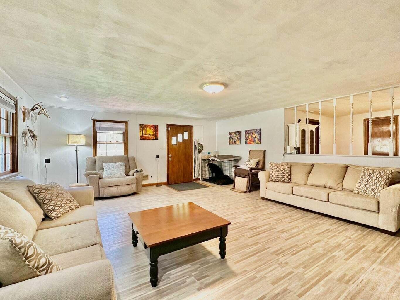 6989 Poage Valley Rd Extension Roanoke, VA 24018 - Photo 7 of 33 a living room with furniture and a wooden floor
