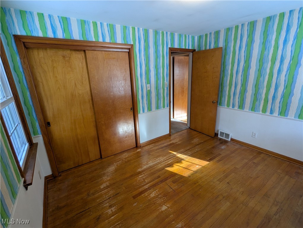 815 East Schaaf Road Independence, OH 44131 - Photo 16 of 36 Unfurnished bedroom featuring a closet and wood-type flooring