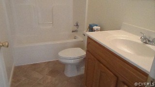 5124 Abilene Road Farmville, VA 23901 - Photo 6 of 10 a bathroom with a sink a toilet and shower