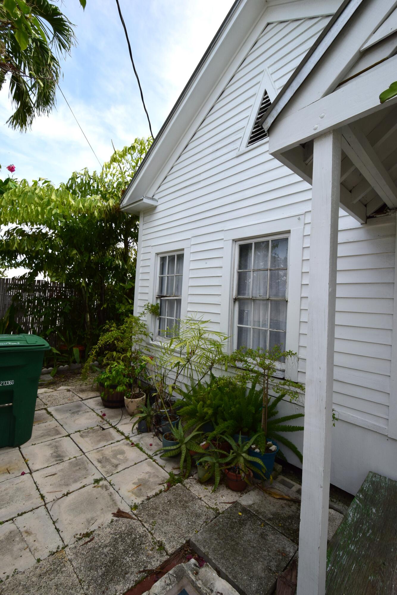 1102 Whitehead Street Key West, FL 33040 - Photo 12 of 22 a backyard of a house with plants and outdoor seating