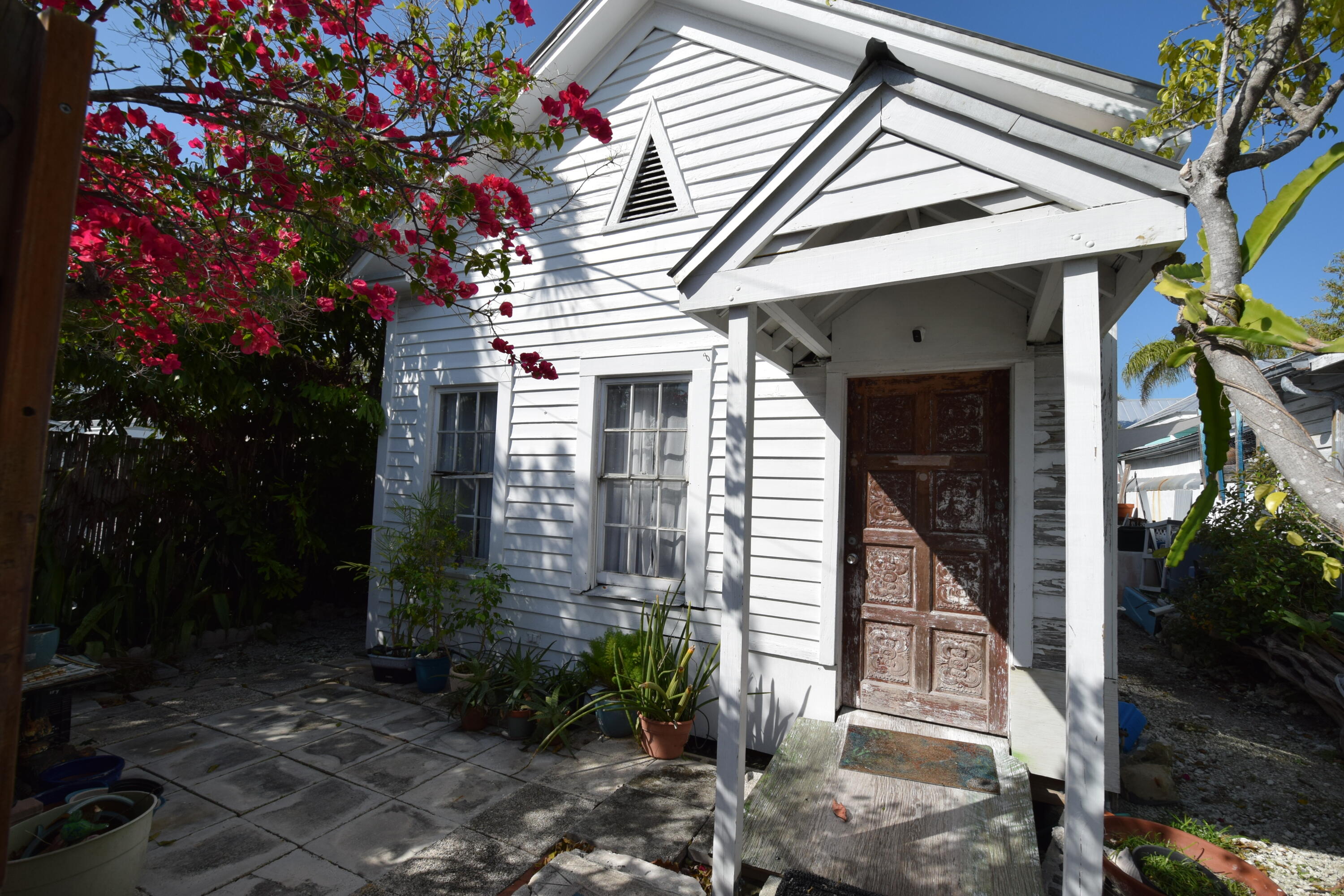 1102 Whitehead Street Key West, FL 33040 - Photo 14 of 22 a front view of a house with a porch