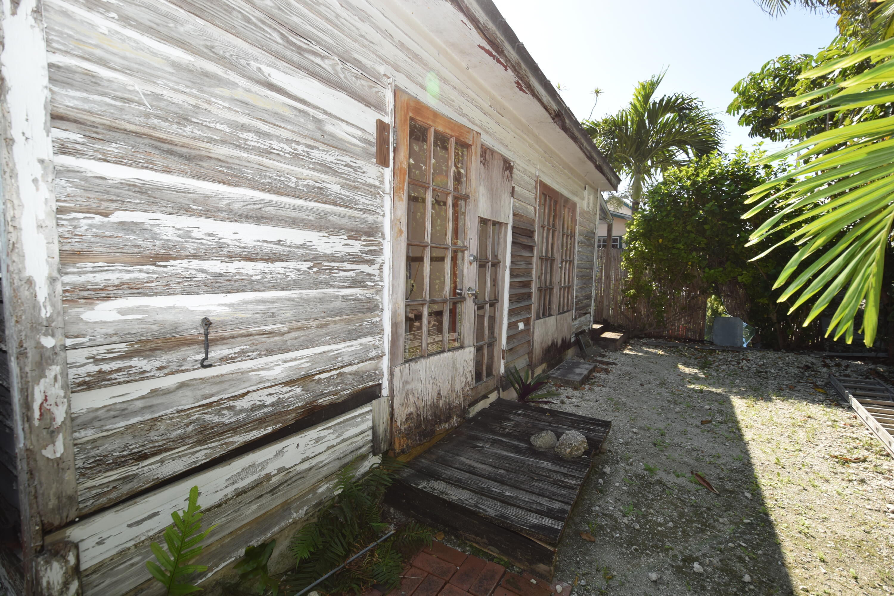 1102 Whitehead Street Key West, FL 33040 - Photo 18 of 22 a view of backyard with wooden fence