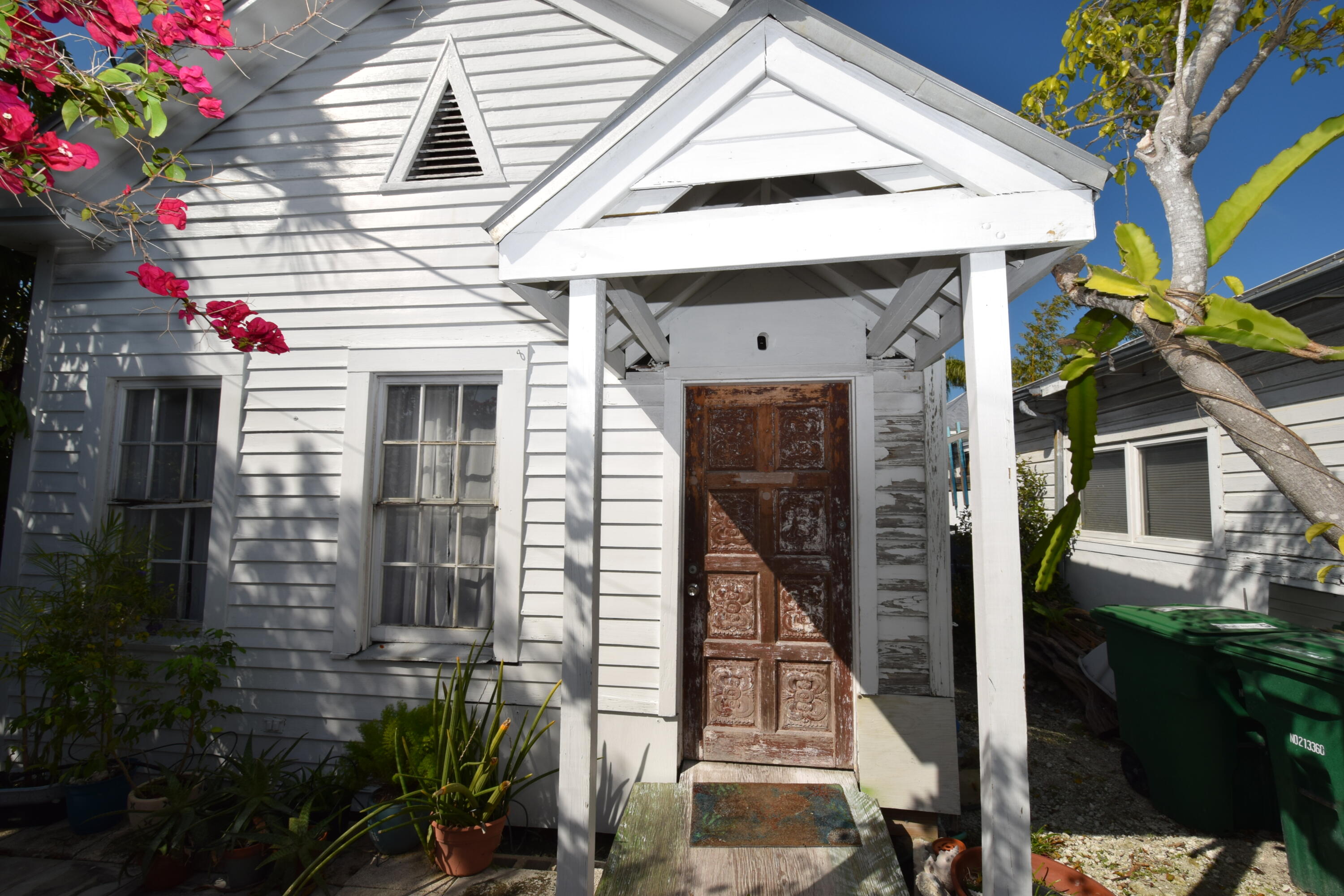 1102 Whitehead Street Key West, FL 33040 - Photo 3 of 22 a front view of a house with a yard
