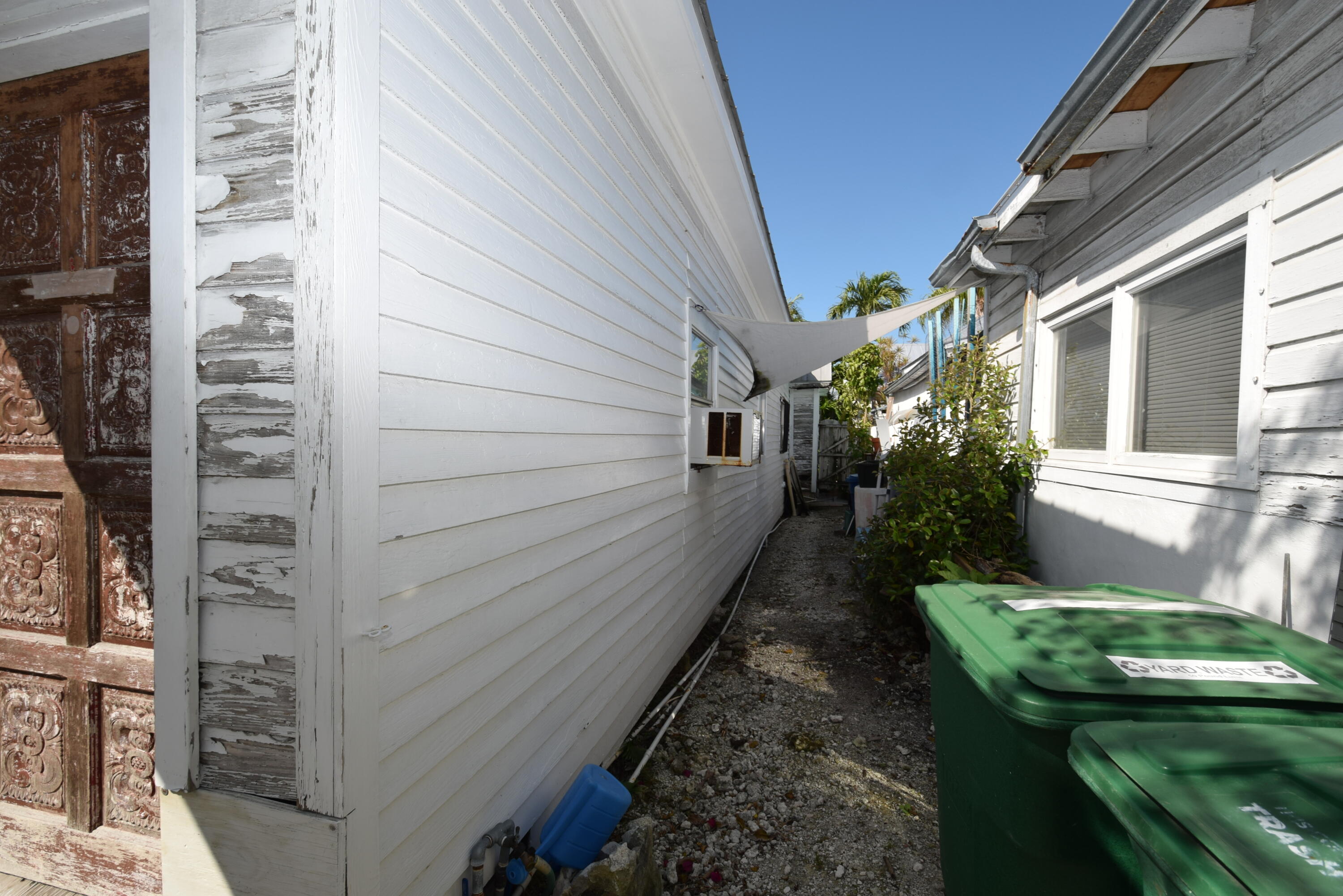 1102 Whitehead Street Key West, FL 33040 - Photo 5 of 22 a balcony with chairs and potted plants