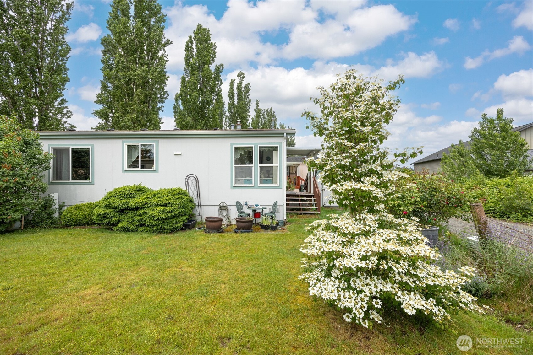 380 East Pole Road, Unit 6 Lynden, WA 98264 - Photo 37 of 40 a view of a house with garden