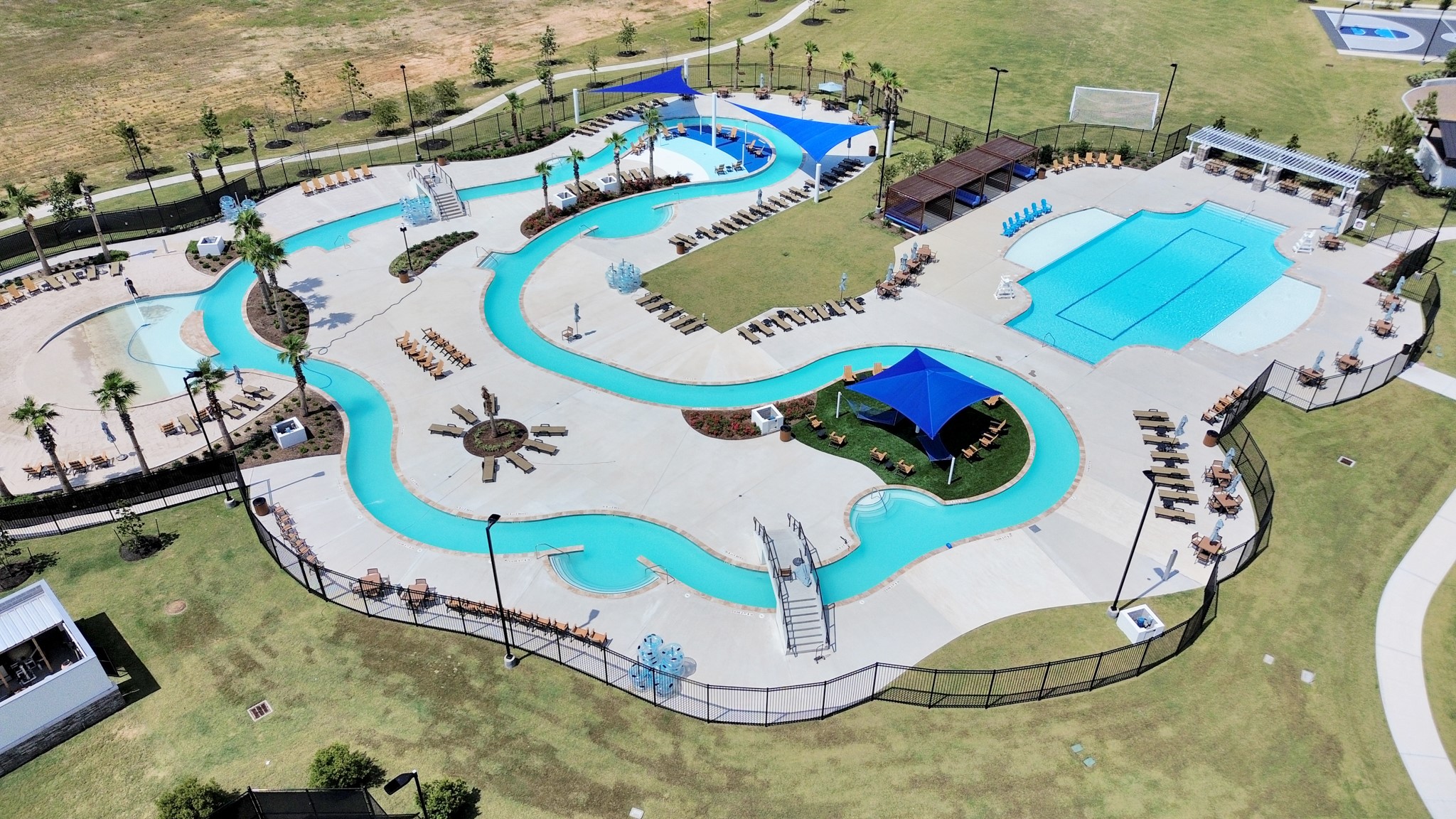 10311 Malta Trce Drive Rosharon, TX 77583 - Photo 2 of 48 For relaxation and recreation residents can enjoy the Resort Style Amenity Village offering:Heated Lazy River,Resort Style Pool,Splash Pad,Playground,Multiple Sports Courts-Basketball,Pickleball,Bocce Ball,Tennis,Sports Field,Sand Beach,Cabana & Hammock area, Clubhouse with Fitness Center,Lounge,Great Room & Outdoor Pavillon.