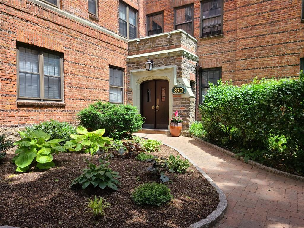 830 Bronx River Road, Unit 5C Bronxville, NY 10708 - Photo 1 of 1 a front view of a house with garden