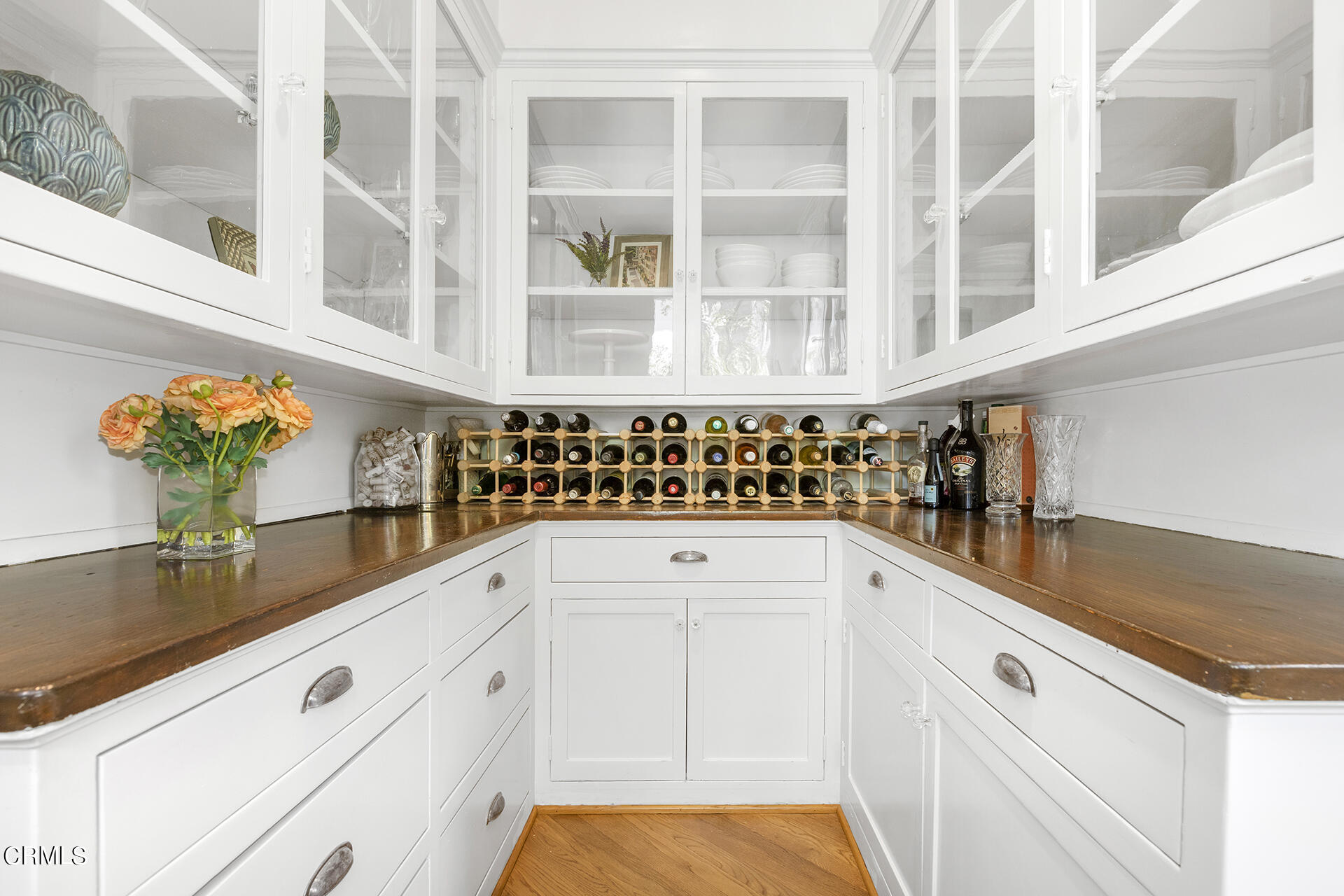 509 Prospect Boulevard Pasadena, CA 91103 - Photo 21 of 68 a view of white cabinets and a potted plant sitting on a counter
