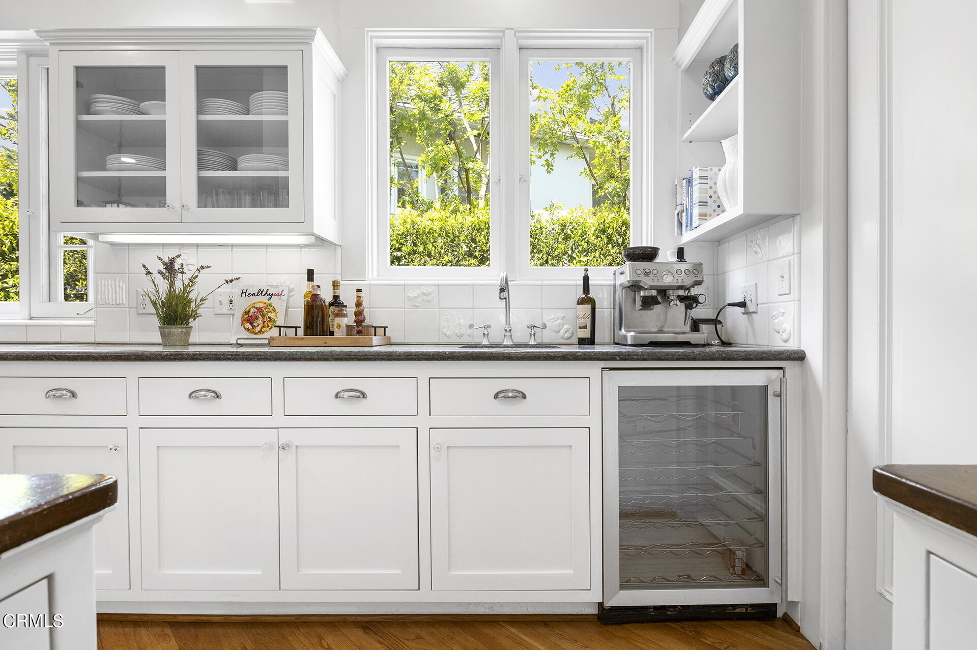 509 Prospect Boulevard Pasadena, CA 91103 - Photo 22 of 68 a kitchen with granite countertop white cabinets and window