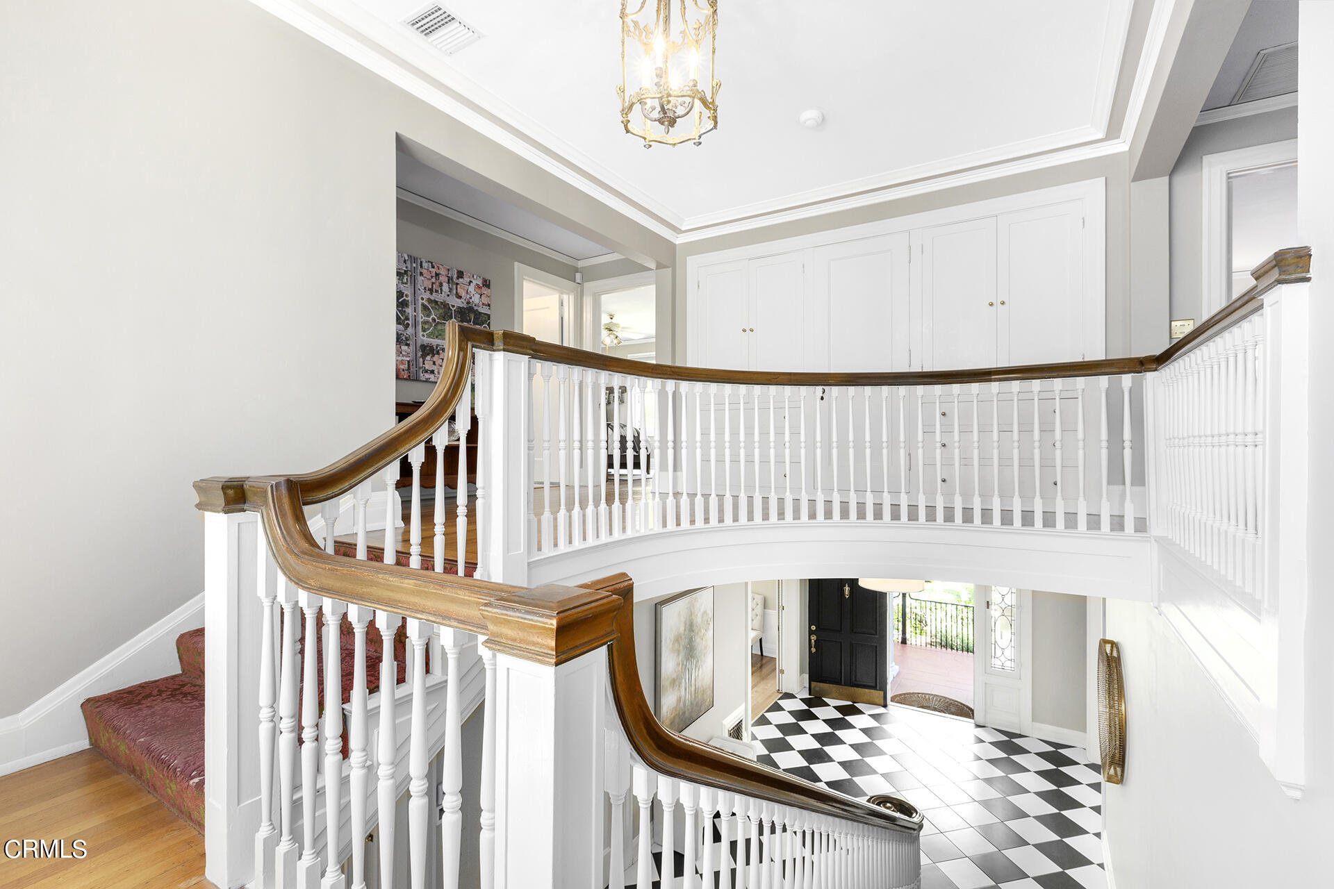 509 Prospect Boulevard Pasadena, CA 91103 - Photo 34 of 68 a view of a hallway with wooden floor and staircase