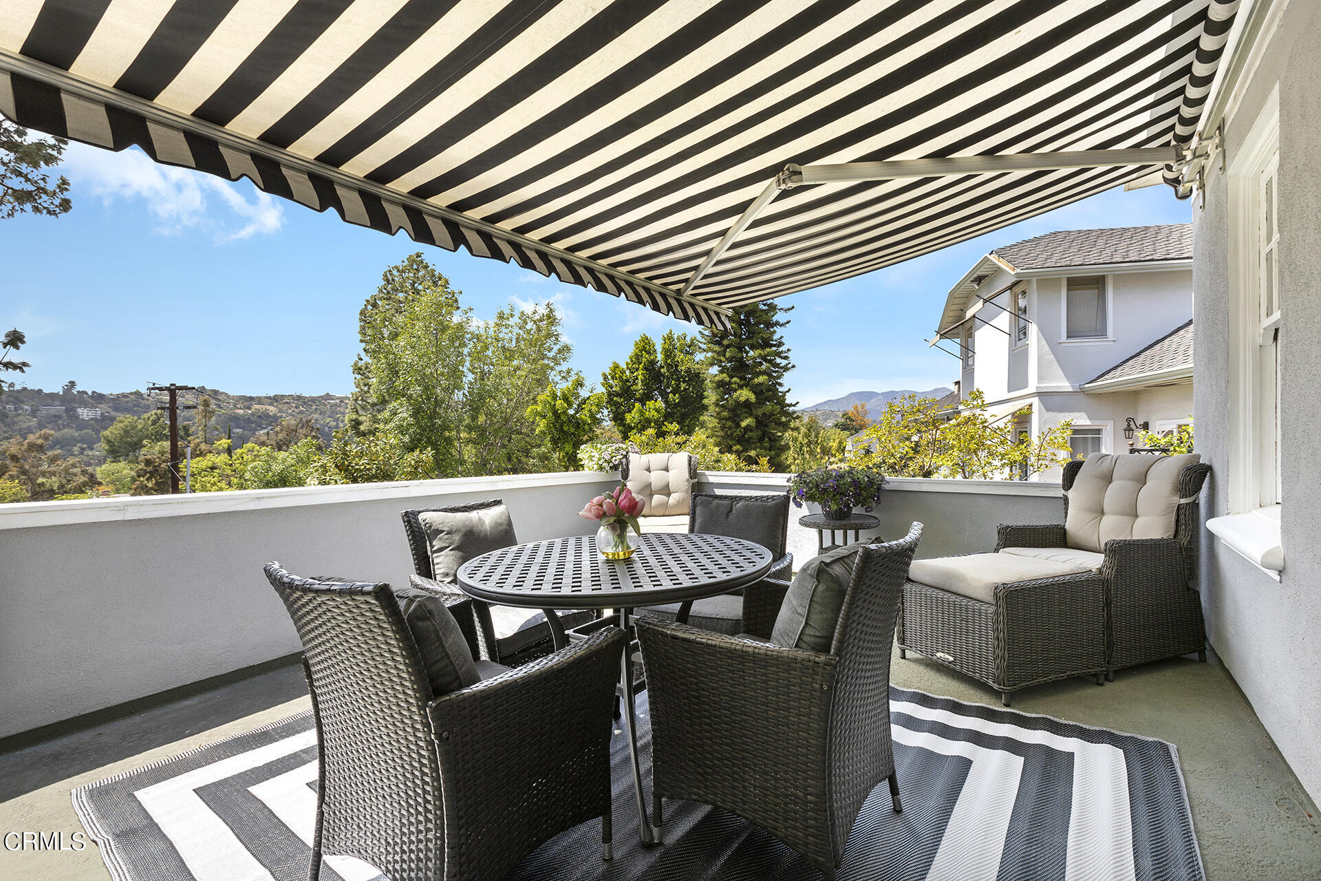 509 Prospect Boulevard Pasadena, CA 91103 - Photo 45 of 68 a view of a patio with couches table and chairs and potted plants