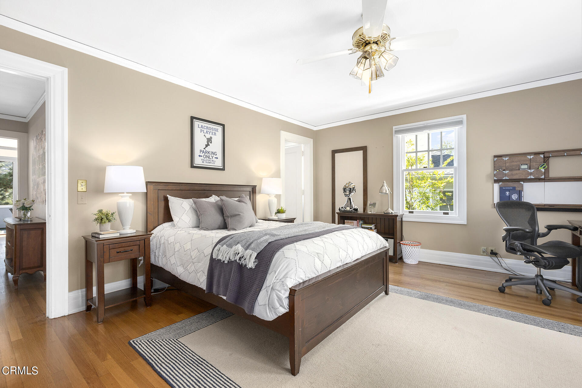 509 Prospect Boulevard Pasadena, CA 91103 - Photo 48 of 68 a spacious bedroom with a bed and a chandelier