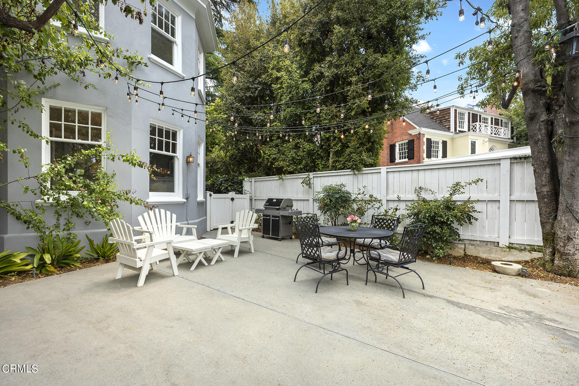 509 Prospect Boulevard Pasadena, CA 91103 - Photo 54 of 68 a view of a patio with table and chairs and potted plants