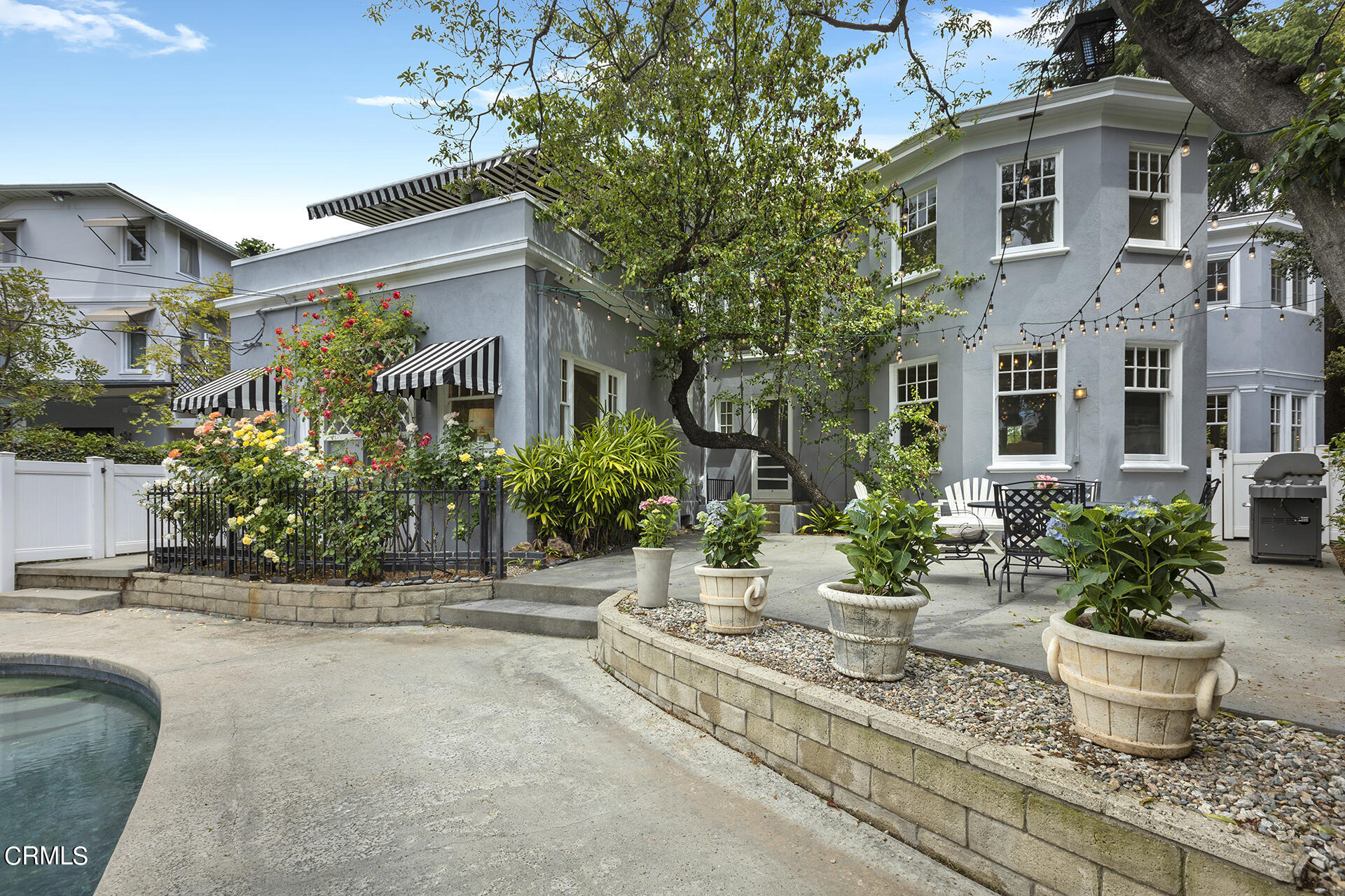 509 Prospect Boulevard Pasadena, CA 91103 - Photo 56 of 68 a view of a house with potted plants and a fountain