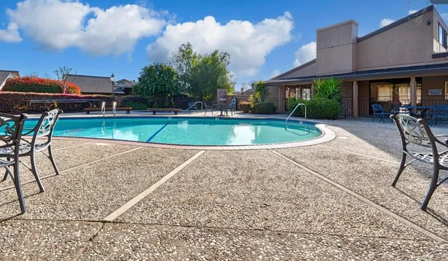 a view of a swimming pool with a patio