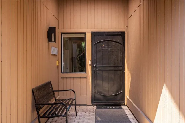 a view of a door and chair in the room