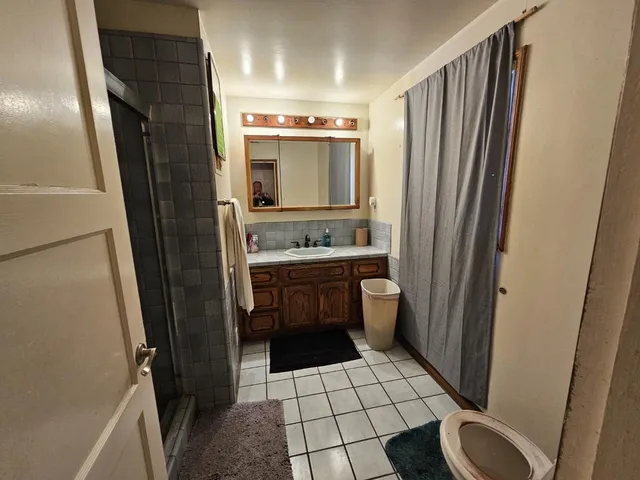 a workspace with furniture and wooden floor