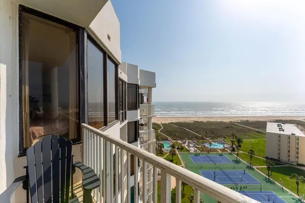 a view of a balcony with an ocean view