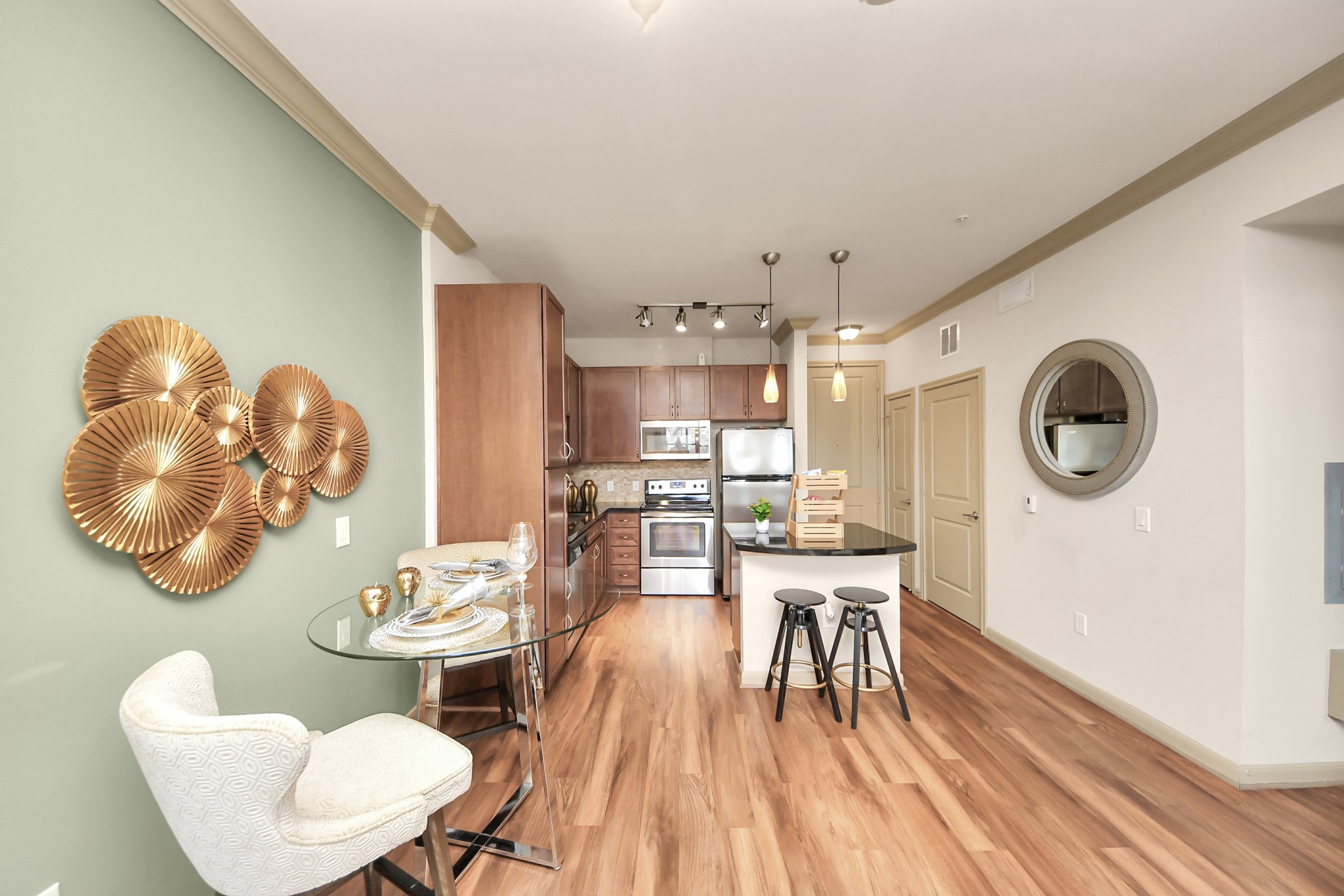 6363 San Felipe Street, Unit 235 Houston, TX 77057 - Photo 13 of 43 a view of a dining room with furniture and wooden floor