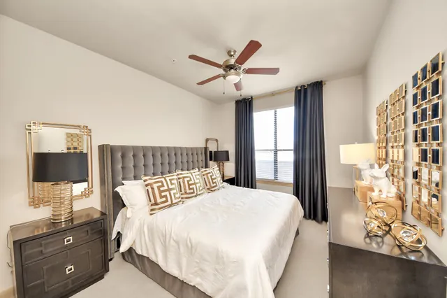 a view of a livingroom with furniture and a window