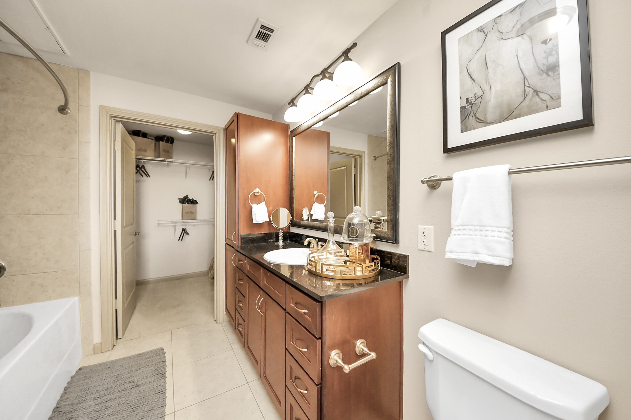 6363 San Felipe Street, Unit 235 Houston, TX 77057 - Photo 19 of 43 a bathroom with a sink a toilet and tub