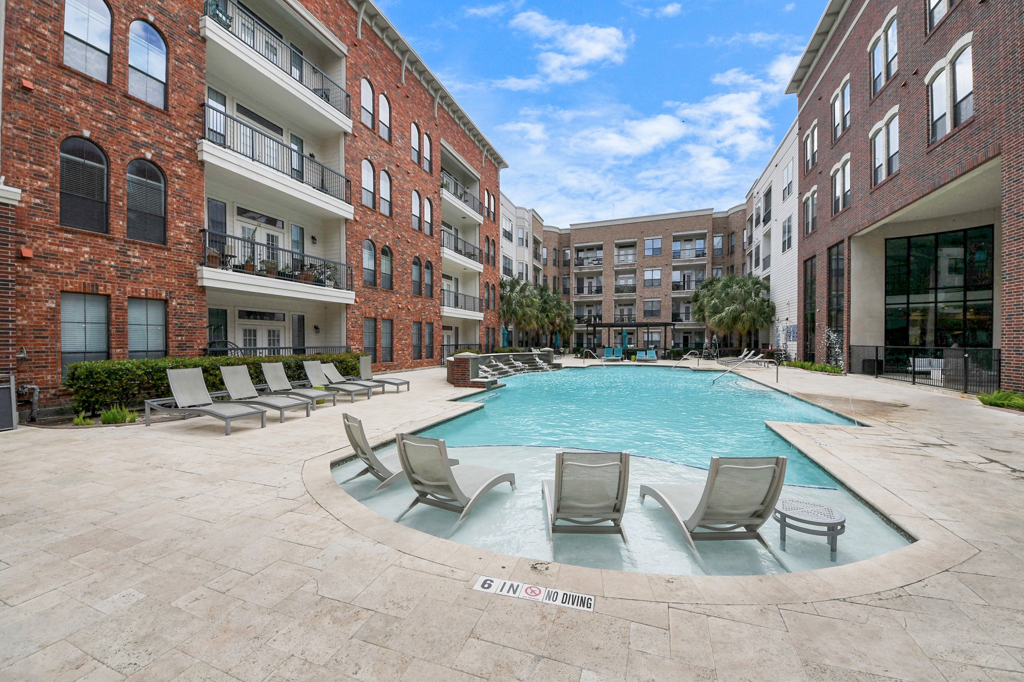 6363 San Felipe Street, Unit 235 Houston, TX 77057 - Photo 32 of 43 a view of a building with a yard