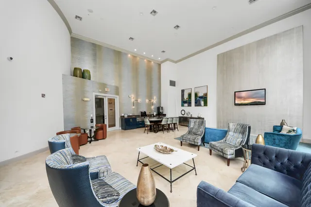 a living room with furniture or couch and a large window