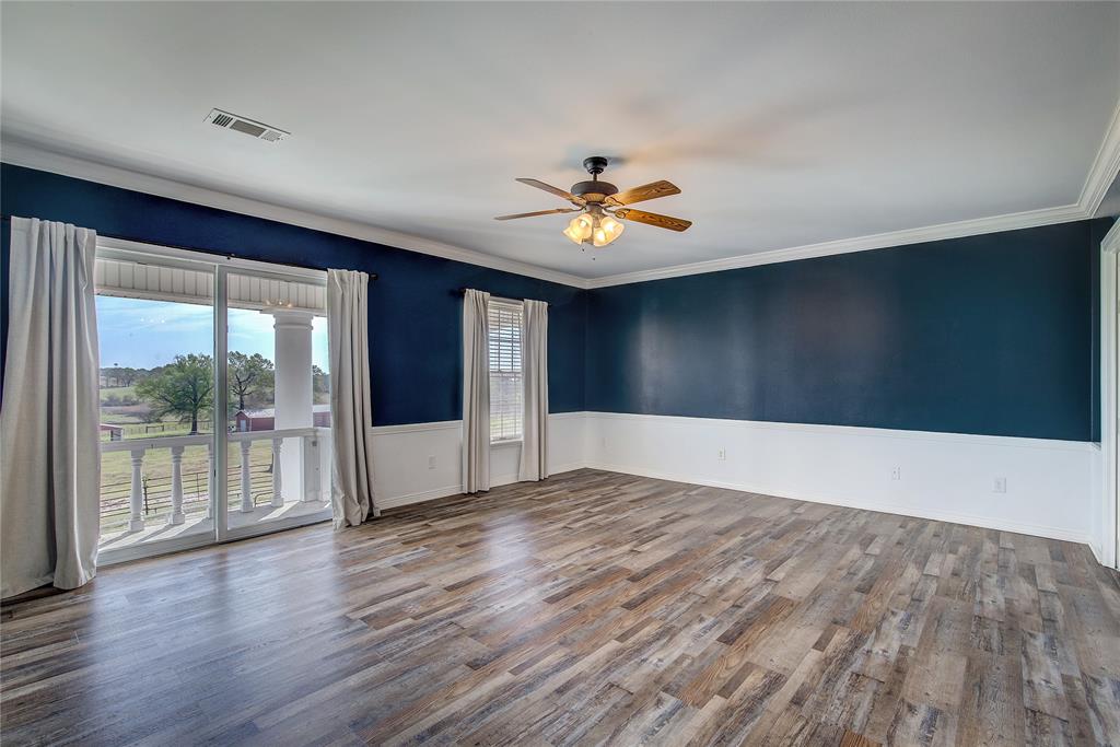 7359 Highway 154 Sulphur Springs, TX 75482 - Photo 25 of 40 upstairs primary has balcony that overlooks pool, Andersen windows