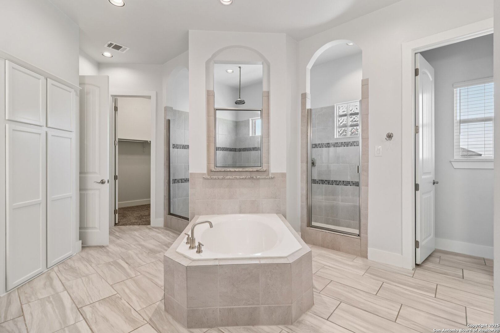 31040 Clover Pass Bulverde, TX 78163 - Photo 13 of 43 a bathroom with a bathtub and shower
