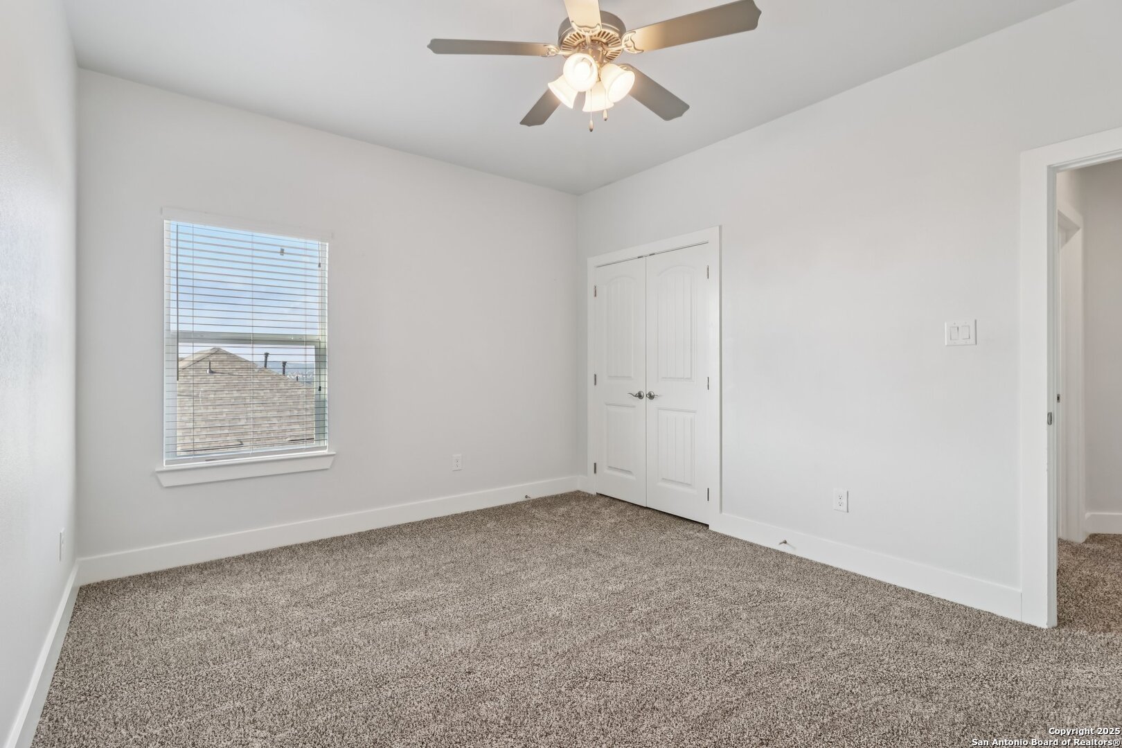 31040 Clover Pass Bulverde, TX 78163 - Photo 24 of 43 an empty room with a window and a fan