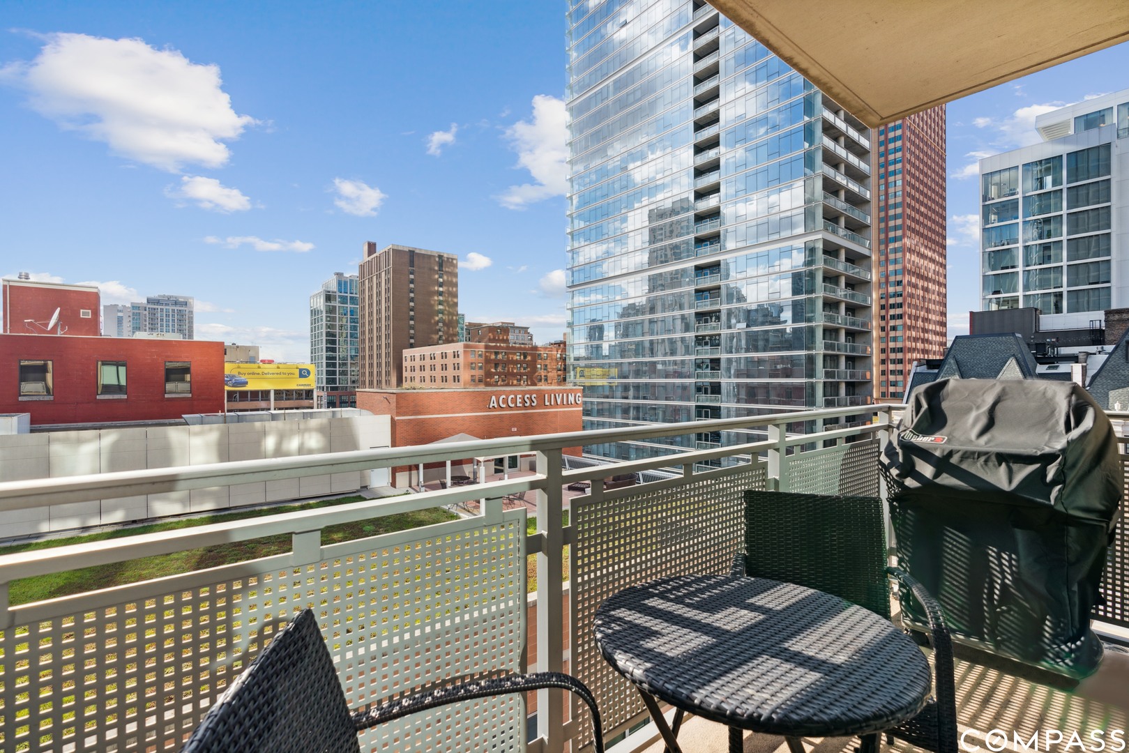 744 North Clark Street, Unit 704 Chicago, IL 60654 - Photo 12 of 12 a view of a balcony with two chairs and a table