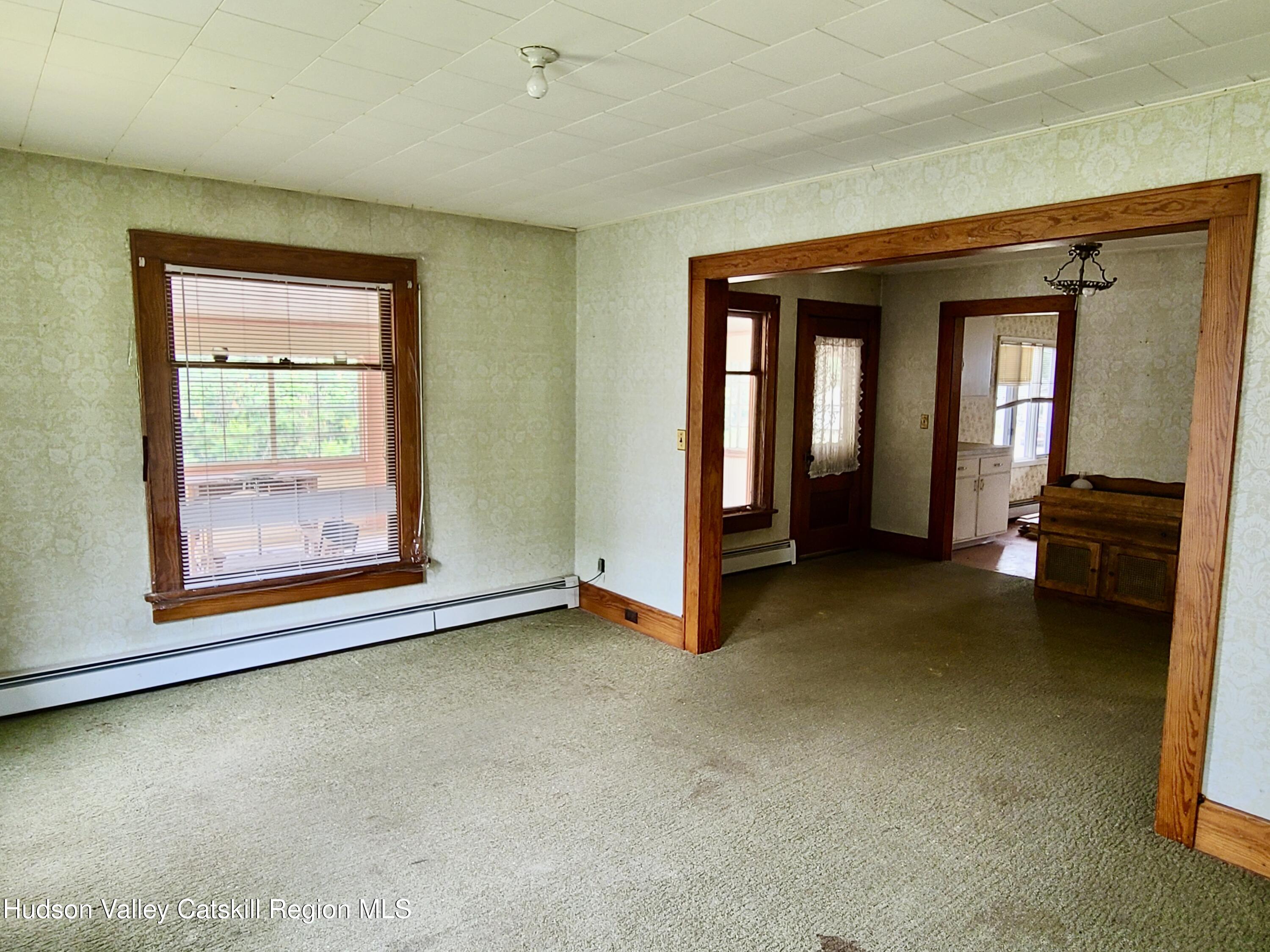 53200 Highway 30 Roxbury, NY 12421 - Photo 17 of 44 an empty room with furniture and a window