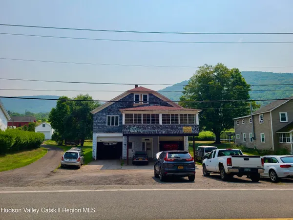 a view of a cars in front of a house