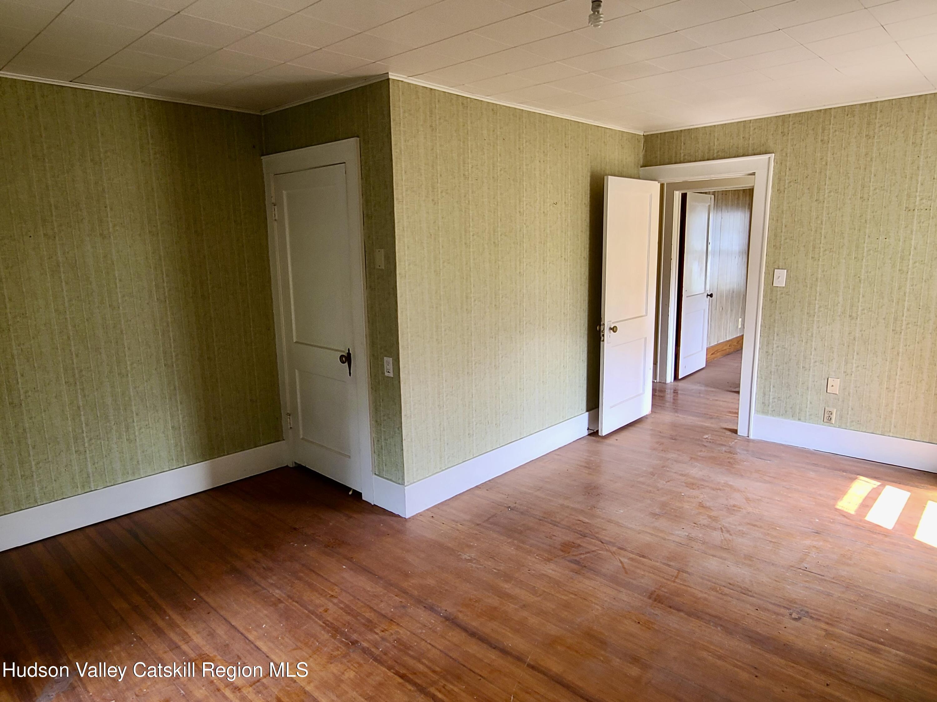 53200 Highway 30 Roxbury, NY 12421 - Photo 21 of 44 a view of an empty room with wooden floor and a window