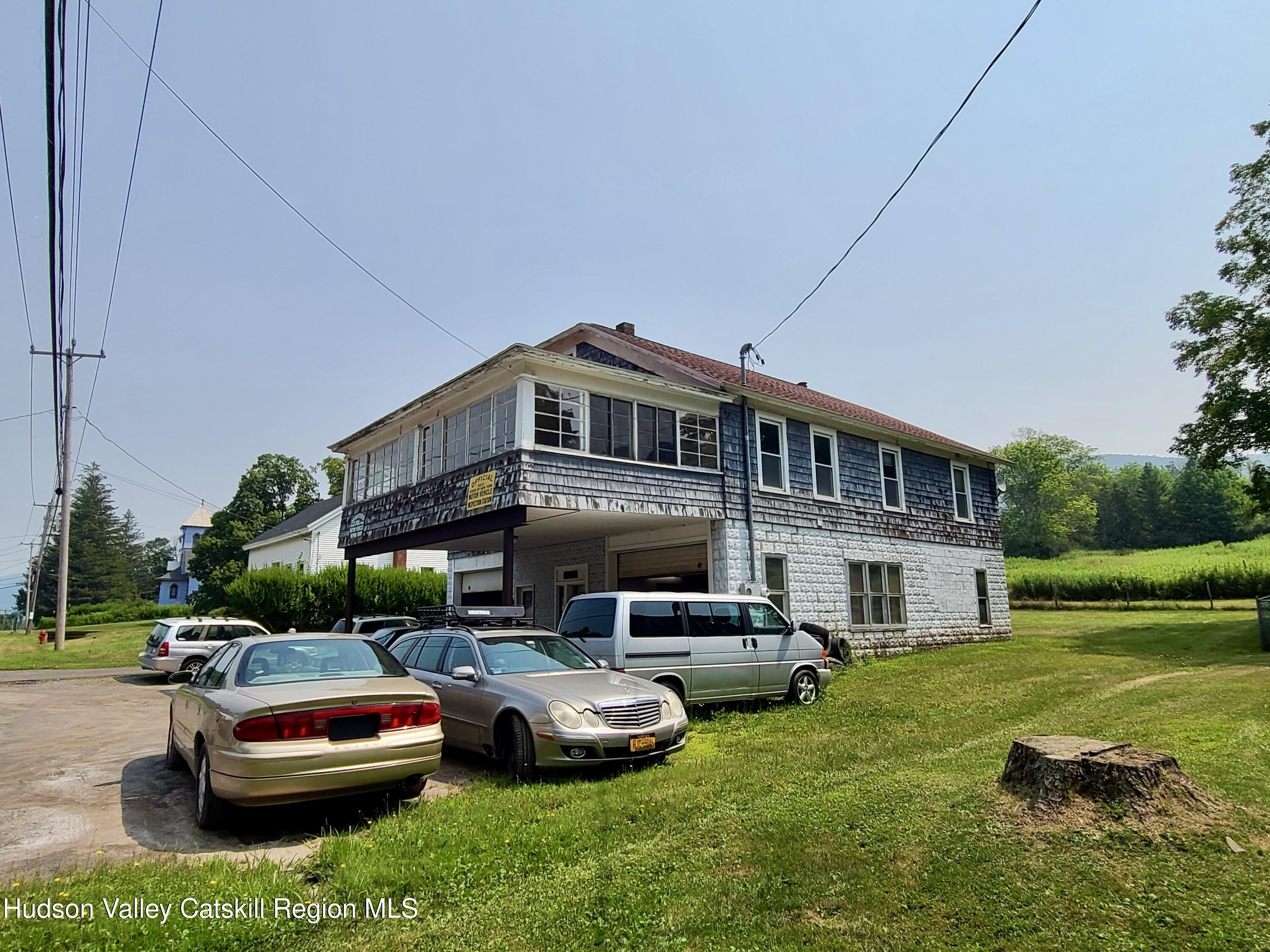 53200 Highway 30 Roxbury, NY 12421 - Photo 3 of 44 a car parked in front of a house and a yard