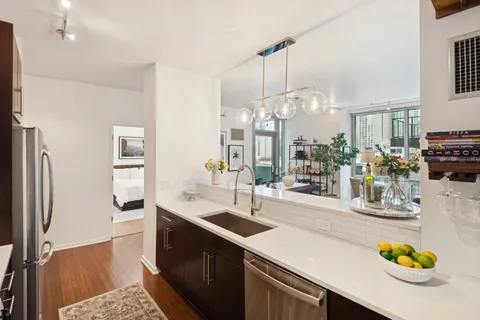 a kitchen with a sink stove and refrigerator