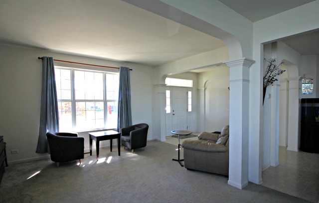 3082 Patterson Road Montgomery, IL 60538 - Photo 3 of 25 a view of a livingroom with furniture and windows
